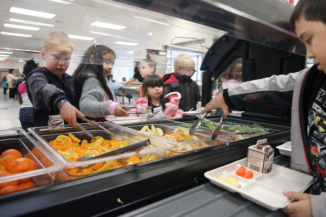 FILE ⁠— Students at East Port Orchard Elementary visit the fruit and salad bar lunch in January 2019.