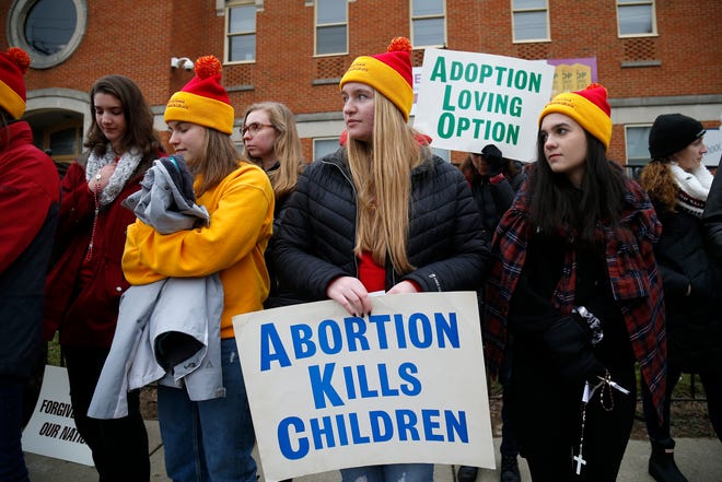 Demonstrators protest at a national March for Life event in Cincinnati.