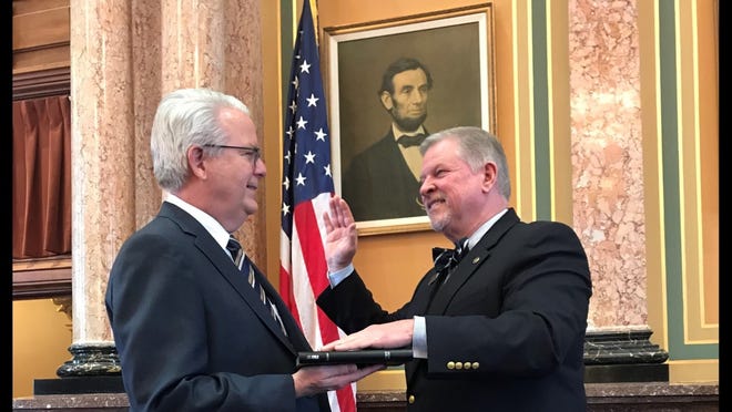 Rep. Scott Ourth is sworn in for his fourth term in the Iowa House of Representatives by Assistant Leader John Forbes.