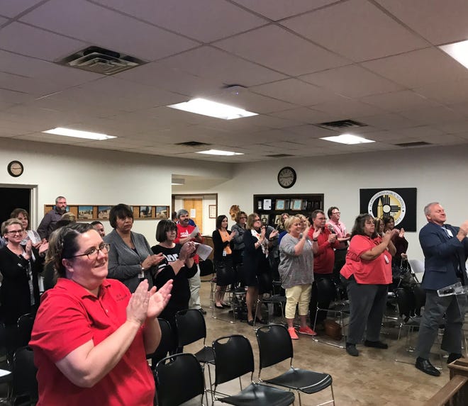 The Alamogordo Public School District board meeting room erupted in a standing ovation for the board's decision to name Jerrett Perry APS superintendent. Perry has been serving as acting/interim superintendent since September.