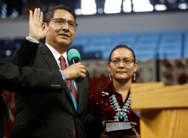 Jonathan Nez is sworn in as president of the Navajo Nation on Tuesday at the Bee Hółdzil Fighting Scouts Events Center in Fort Defiance, Ariz. Nez named several members of his cabinet this week.