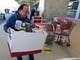 Erwin Guzman drops a food and supply donation for TAS workers at Orlando International Airport Wednesday, Jan. 16, 2019, in Orlando, Fla.  as the partial government shutdown moves through its fourth week Wednesday, Jan. 16, 2019, in Orlando, Fla. (AP Photo/John Raoux) ORG XMIT: FLJR105