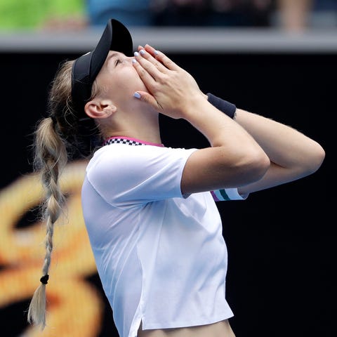 Amanda Anisimova celebrates after defeating Aryna...