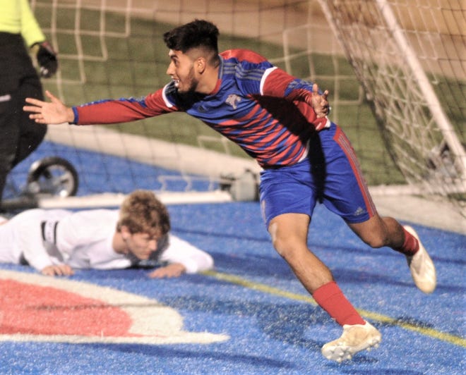 Cooper's Michael Rangel, right, celebrates after scoring the tying goal with 30:33 left in the game against Abilene High. The teams played to a 2-2 tie in the nondistrict boys soccer game Friday, Jan. 18, 2019, at Shotwell Stadium.