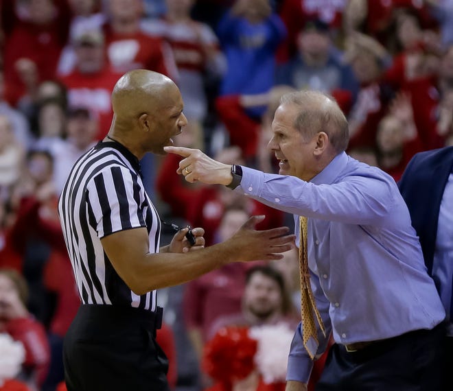 Michigan head coach John Beilein, right, argues a technical foul call during the final seconds of the Jan. 19 game.