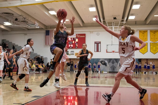 Both the Rocky Mountain and Fort Collins girls basketball teams, shown in a file photo, lost their first-round playoff games on Tuesday. Poudre also lost a first-round game.