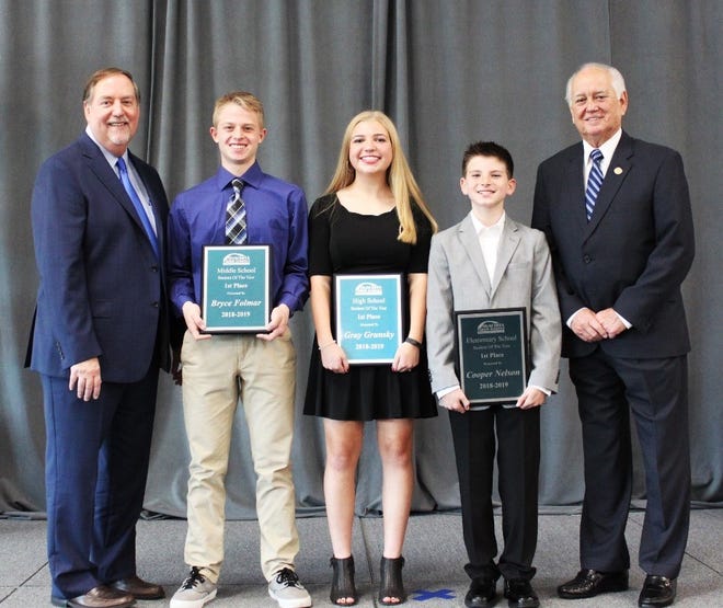 Ouachita Parish Schools Superintendent Don Coker (far left) and School Board President Jerry Hicks (far right) stand with this year's Students of the Year (from left)  Bryce Folmar of West Ridge Middle School, Gray Grunsky of Sterlington High School and Cooper Nelson of Sterlington Elementary School