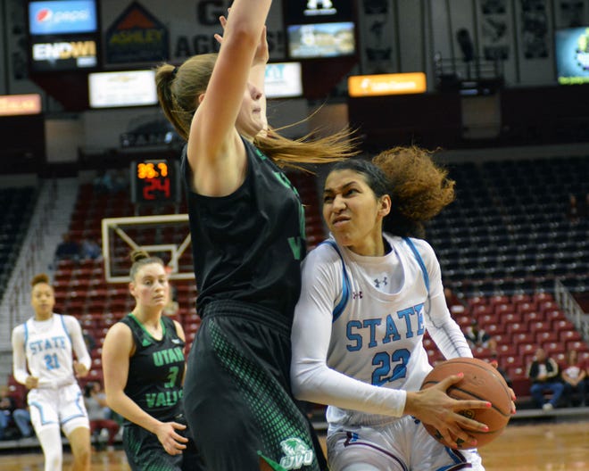 Kalei Atkinson muscles her way inside the lane against Utah Valley on Saturday, Jan. 19, 2019, at the Pan American Center. The Aggies won the game, 58-52, and took over first place in the Western Athletic Conference.