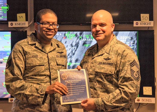 Staff Sgt. Reginald House, Remotely Piloted Aircraft sensor operator instructor, receives the Chief’s Choice Award from Chief Master Sgt. Rick Marston, 49th Operations Group superintendent, Jan. 17, 2019, on Holloman Air Force Base, N.M. Holloman’s Chiefs Group has a monthly recognition program titled Chief’s Choice Award. Every month, a chief has the honor of choosing a deserving Airman for an outstanding act or for continuous outstanding performance.