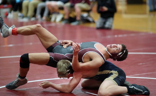 South Kitsap's Deyondre Davis pulls off a spin move against Rogers' Shaine Arzberger during the 160-pound championship at Saturday's South Kitsap wrestling invitational.