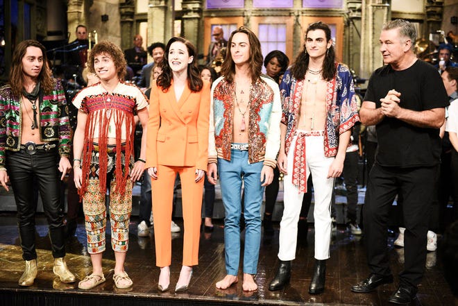 Musical guest Greta Van Fleet, host Rachel Brosnahan, and Alec Baldwin stand on stage after "Saturday Night Live" on Jan. 19, 2019.