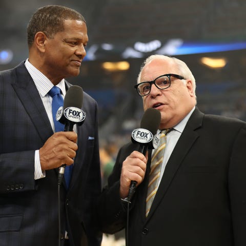 Marques Johnson (left) and Jim Paschke get set to 