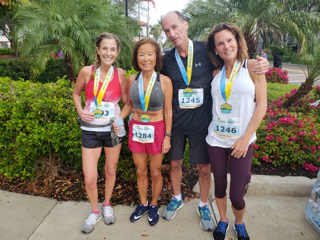 Five members of the Northeast Running Club from Cleveland, Ohio, competed in the Naples Daily News Half Marathon on Sunday. From left, Reggie LaVan, part-time Bonita Springs resident Jeannie Rice, Craig Pulling, and Denise Pulling. The fifth, Angela Pohl, is not pictured.
