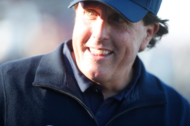 Phil Mickelson is all smiles towards the end of his play at the Stadium Course at PGA West in La Quinta, California on January 19, 2019. Michelson shot a 66 in the third round of the Desert Classic golf tournament. 