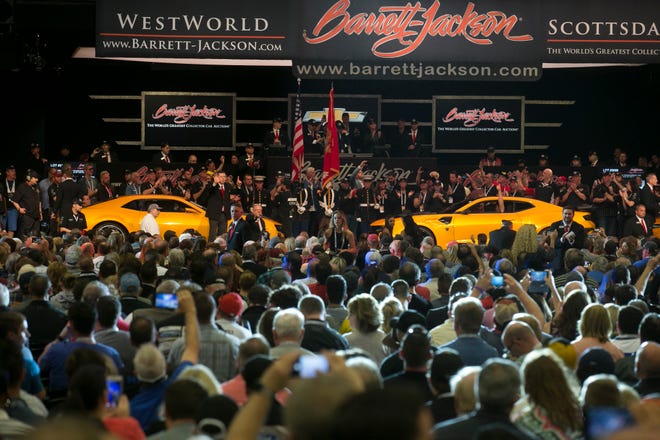 Four original Bumblebee Camaros from the Transformers film franchise sit on the auction block at Barrett-Jackson collector-car auction at WestWorld on Jan. 19, 2019, in Scottsdale. The four sold for $500,000 total with the money going to benefit Operation Homefront, a non-profit that supports military families.