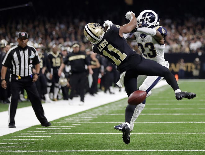New Orleans Saints wide receiver Tommylee Lewis (11) works for a catch against Los Angeles Rams defensive back Nickell Robey-Coleman (23) during the second half of the NFC championship game Sunday. It clearly appeared that Robey-Coleman interfered with Lewis on the play, but no penalty was called. The no-call played a pivotal role in the Rams' 26-23. win.