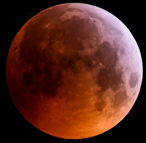 The super blood wolf moon is seen during a total...