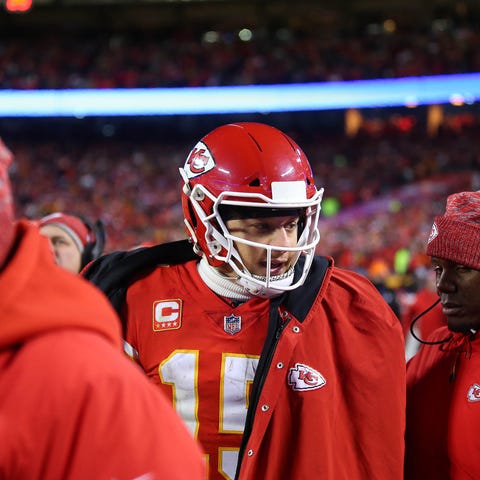 Patrick Mahomes looks on from the sidelines...
