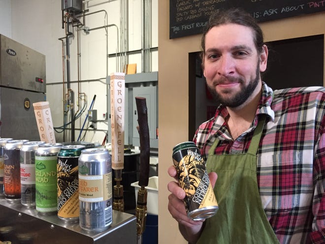 Ricky Klein, aka "Ricky the Meadmaker," holds a can of Coffee Chaos Nitro Mead at Groennfell Meadery in Colchester in 2018.