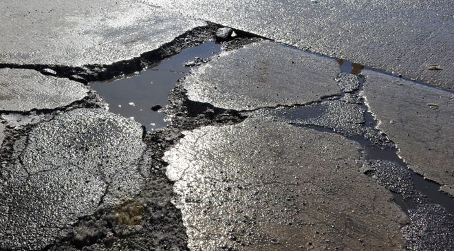 Officials blame the potholes on a rise in temperature that followed an arctic blast over the weekend.