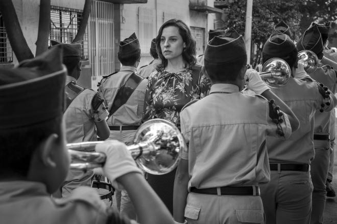 This image released by Netflix shows Marina de Tavira, center, in a scene from the film "Roma," by filmmaker Alfonso Cuaron.