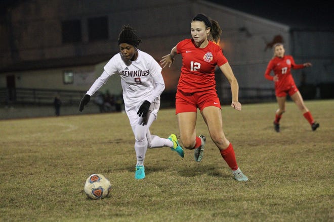 Florida High junior Janae Scott fights for possession against Leon junior Addison Dudley during the Seminoles' 3-2 win at Leon on Jan. 21, 2019. Scott scored two goals in the win.