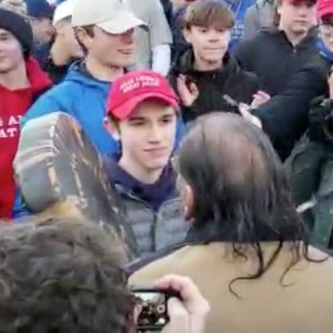 Nick Sandmann seen facing Native American...
