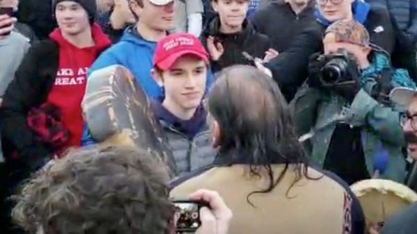 Nick Sandmann seen facing Native American...