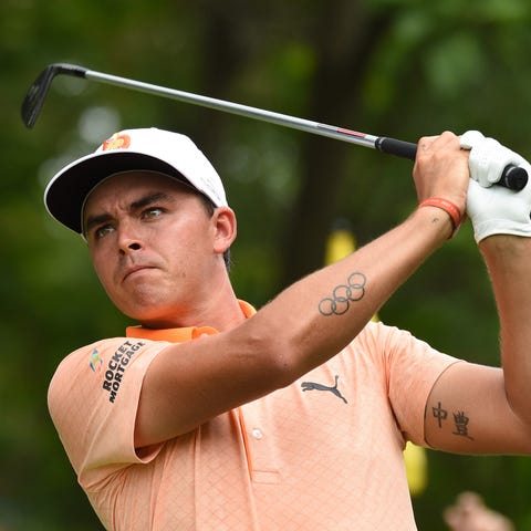 Rickie Fowler hits his tee shot on the 11th hole...