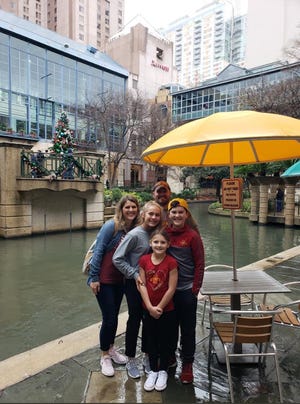 Ankeny fifth-grader Ryan Pruin, right, left his hat adorned with Cyclone players' autographs at a shop on the San Antonio River Walk when Pruin and his family visited for the Alamo Bowl in late December 2018. The hat was returned to Pruin through the power of social media and Jamie Pollard, Iowa State athletic director.