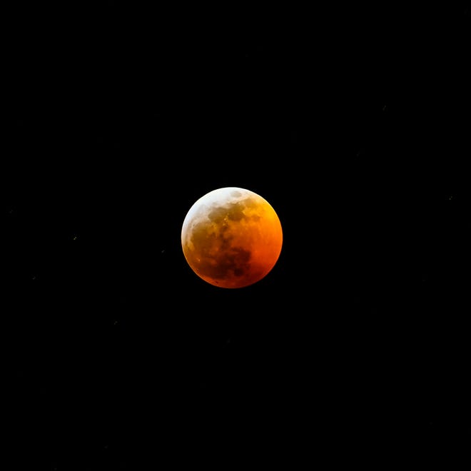 A lunar eclipse is seen from Windsor on Jan. 20, 2018.