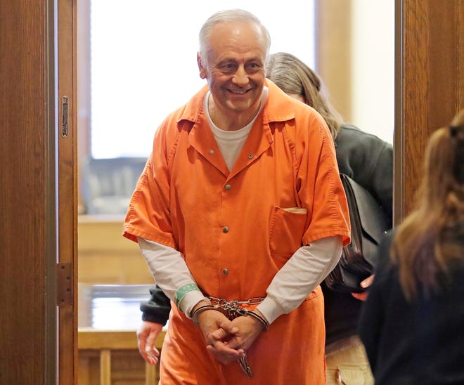 De Pere businessman Ron Van Den Heuvel leaves the courtroom in 2019 after being sentenced to 7.5 years in prison by  U.S. District Court Judge William Griesbach for defrauding investors in Green Box, his recycling business.