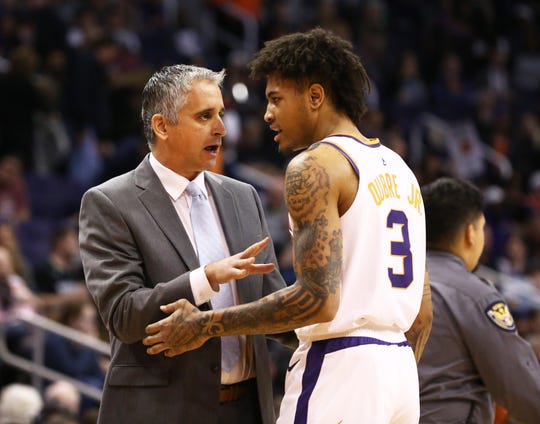 Suns coach Igor Kokoskov talks with Kelly Oubre Jr. during a game against he Timberwolves on Jan. 22.