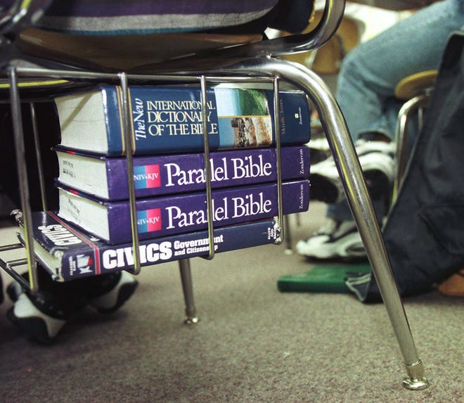Textbooks rest under the seats of Angell Caudill's Biblical History class at Reynolds High School in Winston-Salem, N.C., on Oct. 23, 1997.