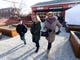 In this Jan. 21, 2019 photo, Brendan Maos, left, walks with his grandmother Darlene Maos, center, and Sylvia Jones as they leave Jon Bon Jovi's community kitchen, Soul Kitchen, in Red Bank, N.J. after being served a free lunch. The kitchen served free meals to furloughed federal workers and their families. Darlene Maos and Jones are federal employees. (Ed Murray/NJ Advance Media for NJ.com via AP) ORG XMIT: NJNEW102