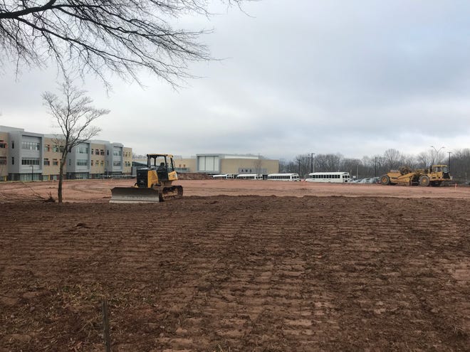 Construction is underway on a new softball field at Asheville Middle School south of downtown.