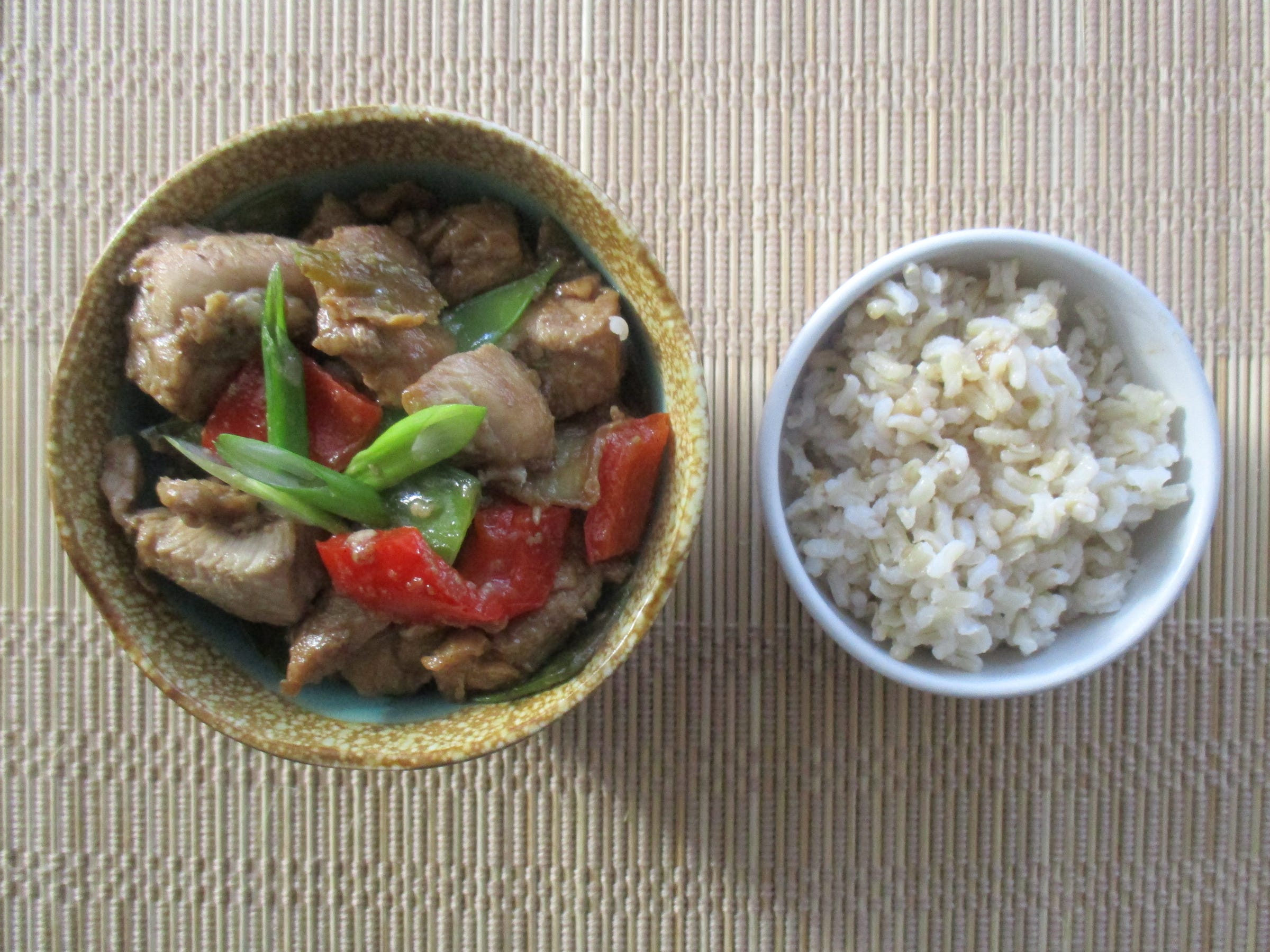 Bourbon Chicken Stir-Fry is served over brown rice.