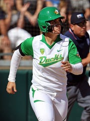 UL softball volunteer assistant coach Geri Ann Glasco, pictured here hitting her third home run of a game against Washington for the Oregon Ducks in 2015, tragically died in an automobile accident early Thursday morning in I-10.