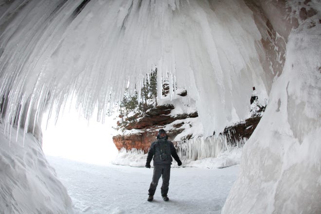 Photojournalist Mark Hoffman did not see another soul for three hours at the ice caves in the Apostle Islands National Lakeshore near Bayfield on Jan. 22, 2014, allowing him to appreciate their natural beauty in solitude. It was the first time the caves were accessible over the ice since 2009.