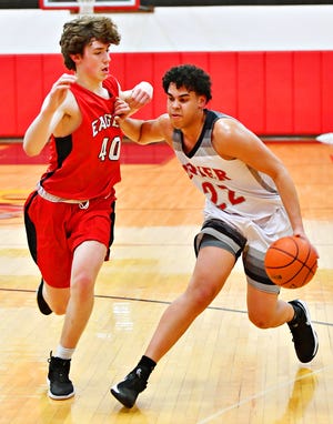 Dover's Elijah Sutton, right, was first in the York-Adams League in scoring this season at 23.6 points per game. Dawn J. Sagert photo