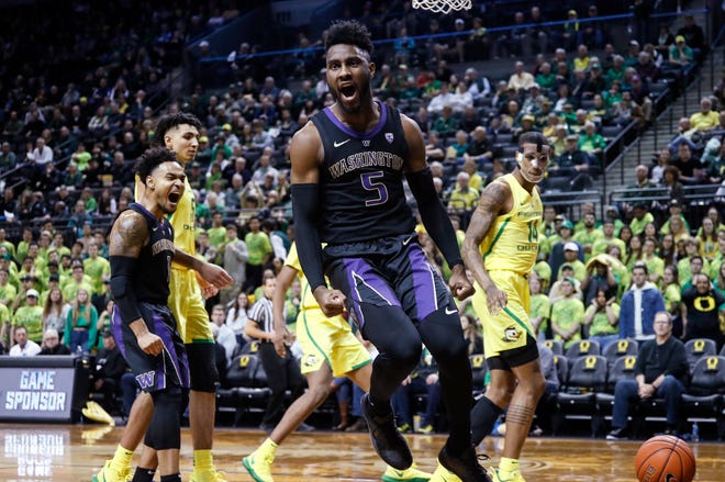 CORRECTS SPELLING OF JAYLEN NOWELL - Washington's Jaylen Nowell (5) celebrates a dunk against Oregon during an NCAA college basketball game Thursday, Jan. 24, 2019, in Eugene, Ore. (AP Photo/Thomas Boyd)