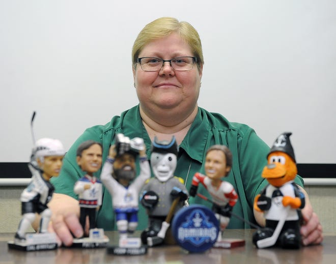 Gail Burchardt was scheduled to attend her 1,000 consecutive Milwaukee Admirals home game Friday, Jan. 25. This photo from 2016 shows her at work with her Admirals memorabilia, after the Admirals awarded her a plaque for No. 900.