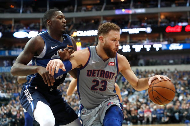 Pistons forward Blake Griffin is defended by Mavericks forward Dorian Finney-Smith during their recent game.