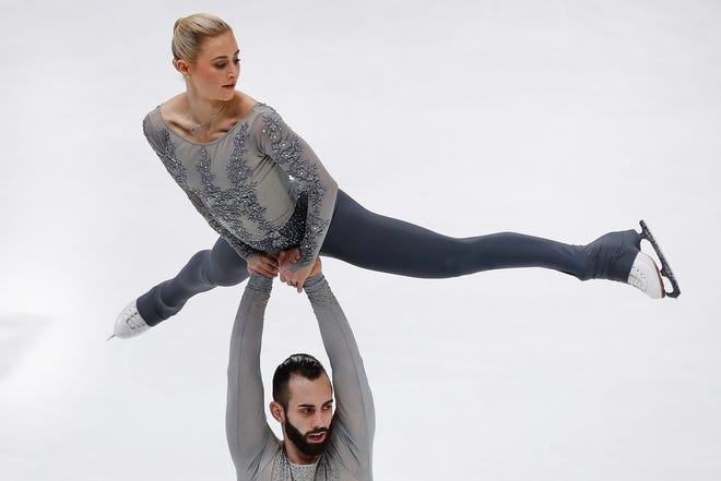 Ashley Cain and Timothy LeDuc perform during their pairs free skate program Saturday at the U.S. Figure Skating Championships at Little Caesars Arena in Detroit.