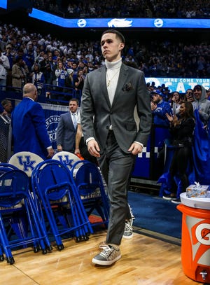 Kentucky's Brad Calipari dressed in a suit with Gucci sneakers for the game against Kansas Saturday, January 26, 2019.
