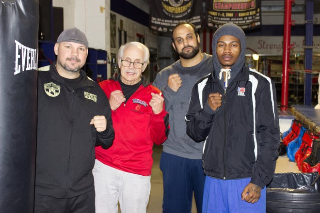 Chad Jacquillard, Metro Detroit Golden Gloves coach; joins Paul Soucy, Dynamic Boxing Club trainer; with Golden Gloves competitors Jonathan Aneed and Shontae Yelder.