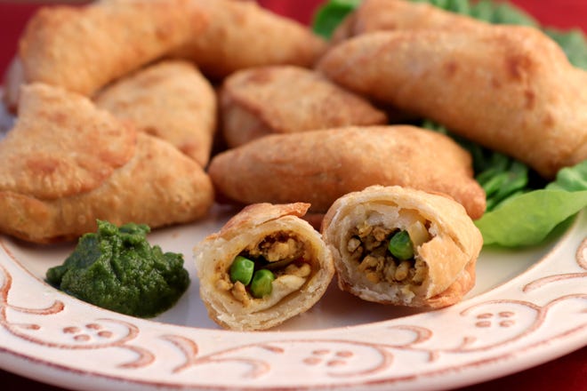 Chicken samosas with mint chutney.