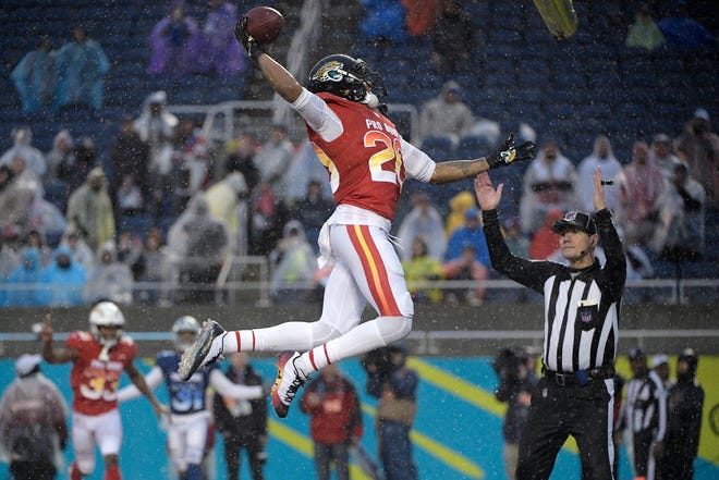Jalen Ramsey of the Jacksonville Jaguars, dunks the football after scoring against the NFC during the second half of the  Pro Bowl on Sunday.