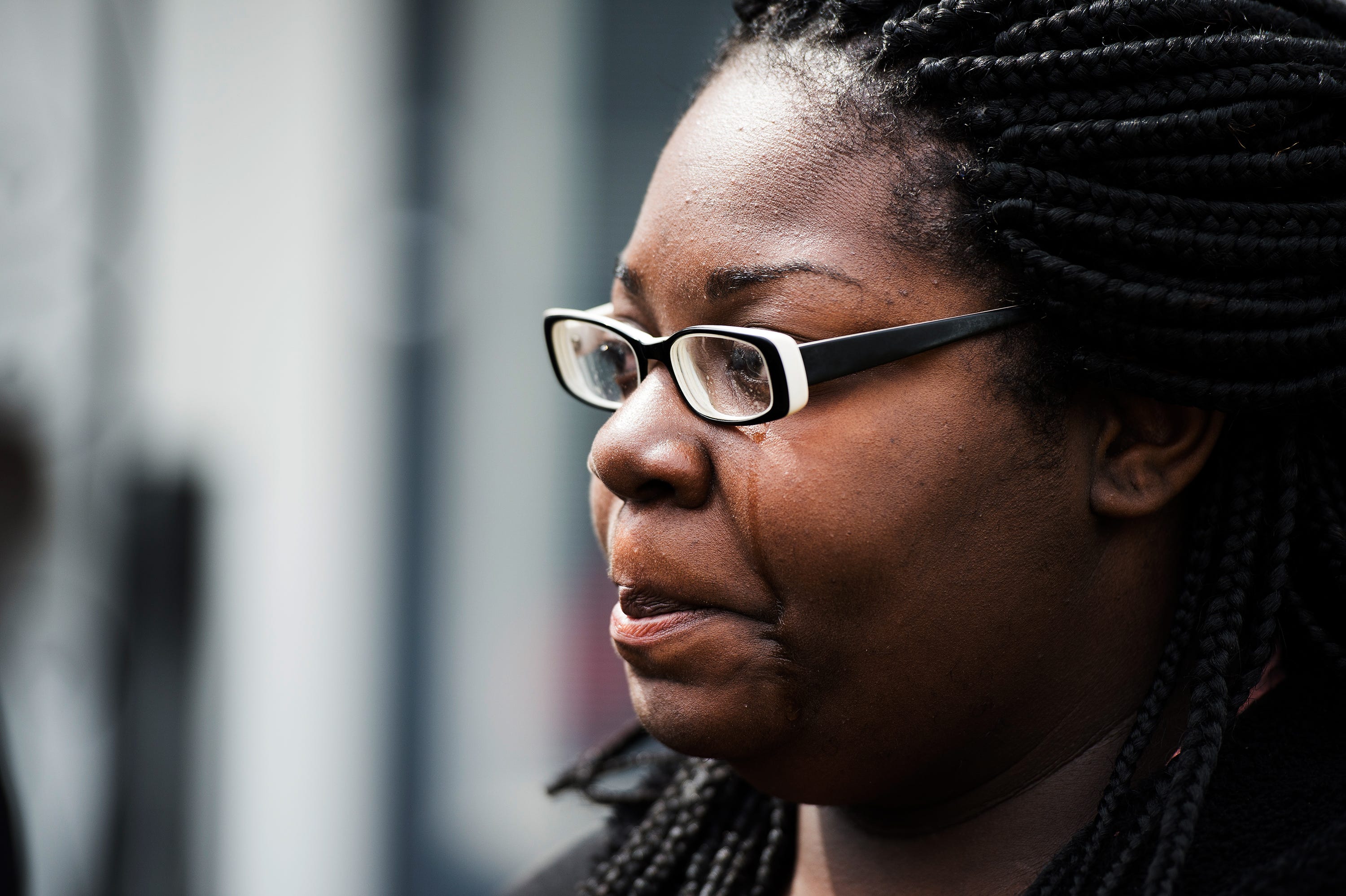 Tiffany Copeland sheds tears during the first press conference she and her family held about the officer-involved shooting death of her fiancee Jermaine Massey in front of her home on Wednesday, March 21, 2018.