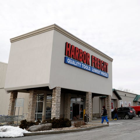 People enter and exit the Harbor Freight store Mon